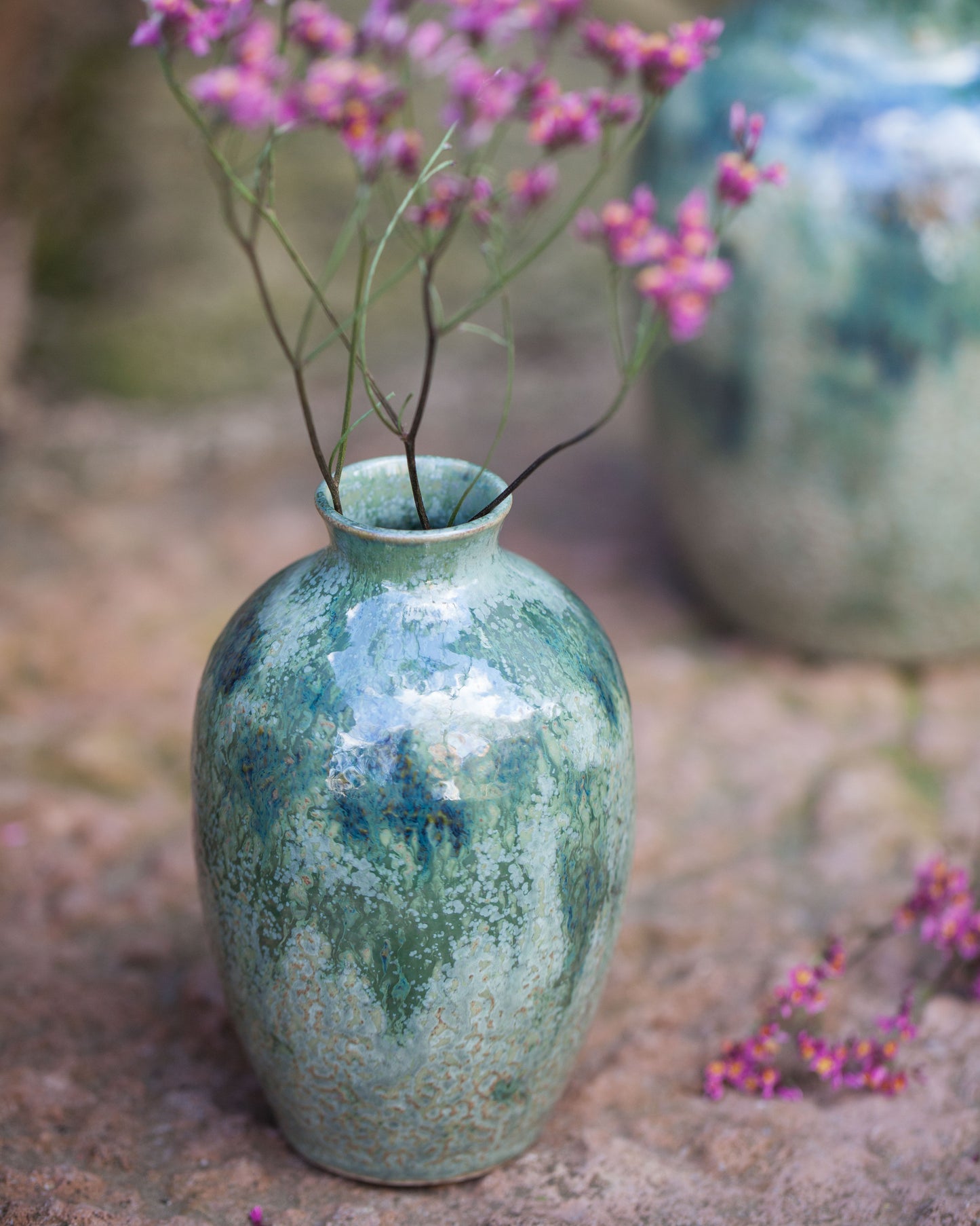 Knackad vas grönmelerad