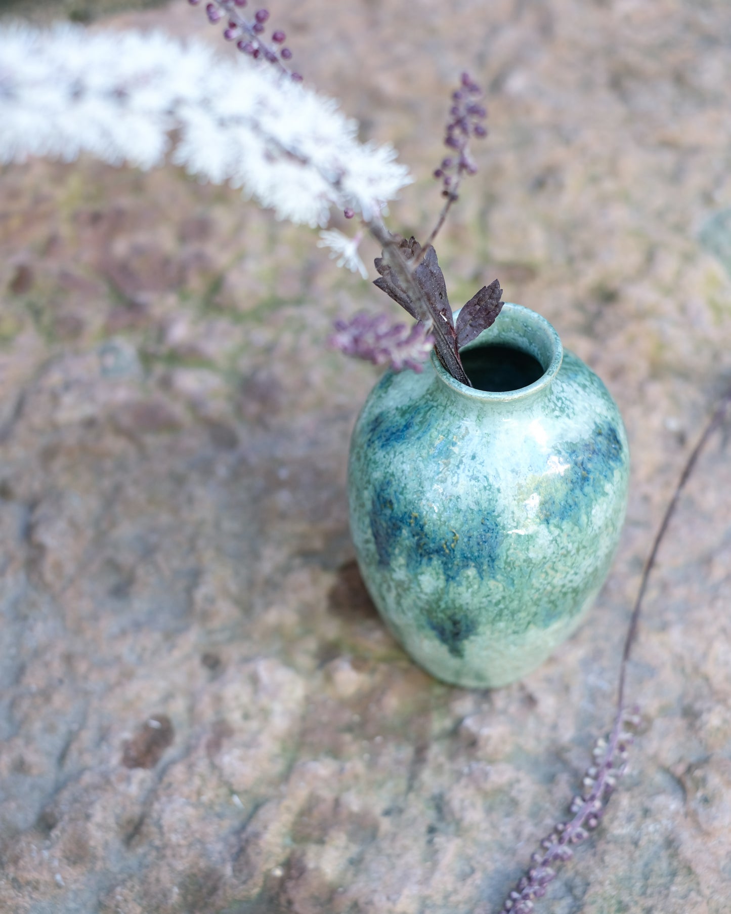 Knackad vas grönmelerad